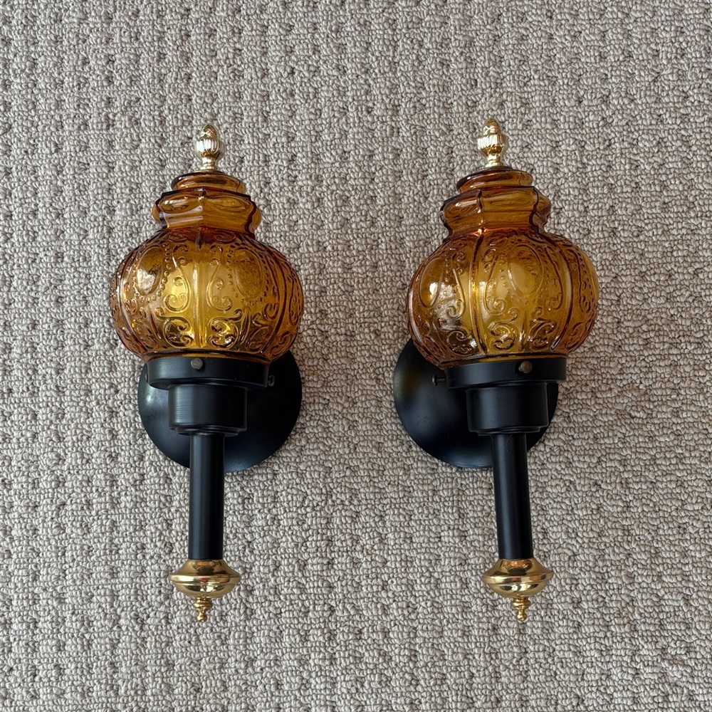 Amber Glass Wall Sconces with Black and Gold Accents